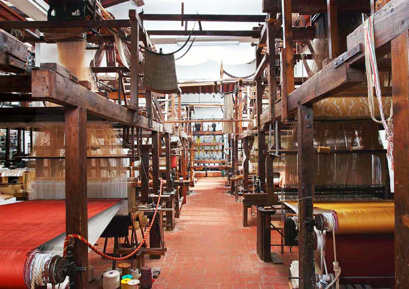 Historic wooden looms in an Italian textile workshop